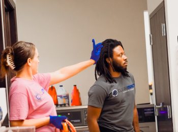 Team members at Clean Impact LLC in a training session, demonstrating teamwork and communication skills in a cleaning environment.